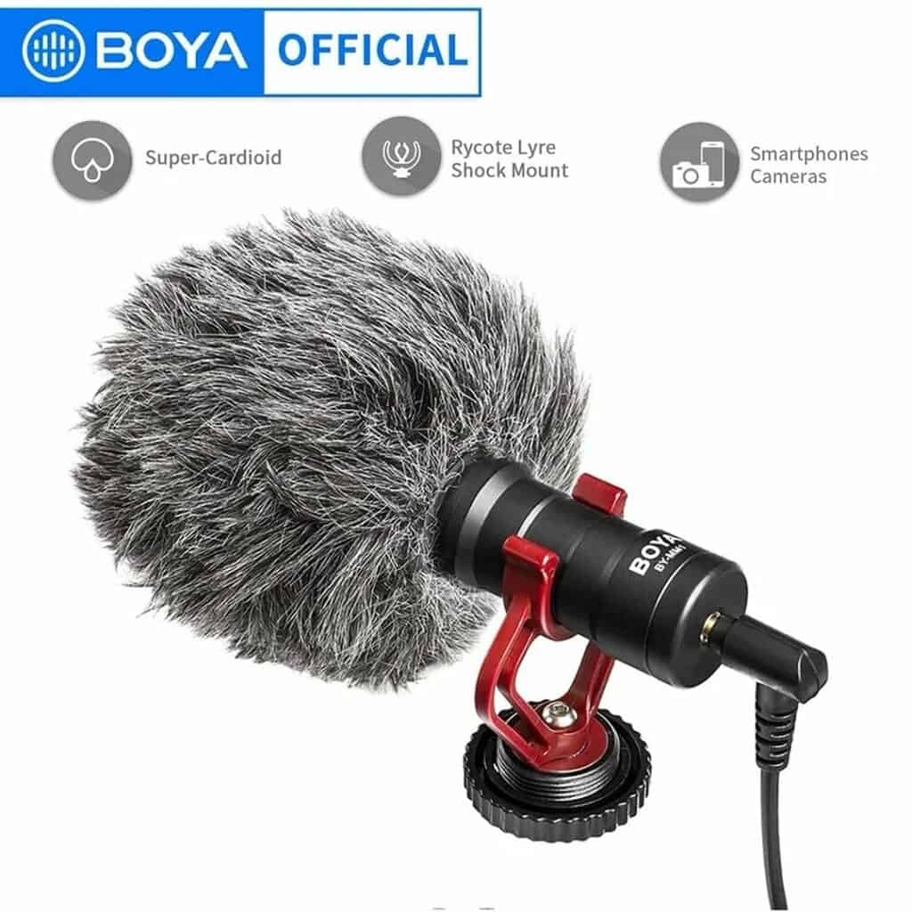 Professional boom microphone with furry windscreen for audio recording, shock mount, and compatibility with smartphones and cameras, ideal for content creators and videographers.