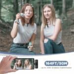 Bubbles blowing by two young women outdoors with wireless microphone and 164ft wireless transmitter in a natural forest setting.