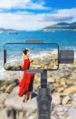 3-axis gimbal stabilizer for smartphones with multi-function push rod, portable design, ideal for professional photography and videography at the beach or outdoor locations.