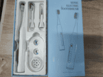 Electric toothbrush set with replacement heads and charger, modern dental care kit, best for oral hygiene, rechargeable sonic toothbrush for adults.