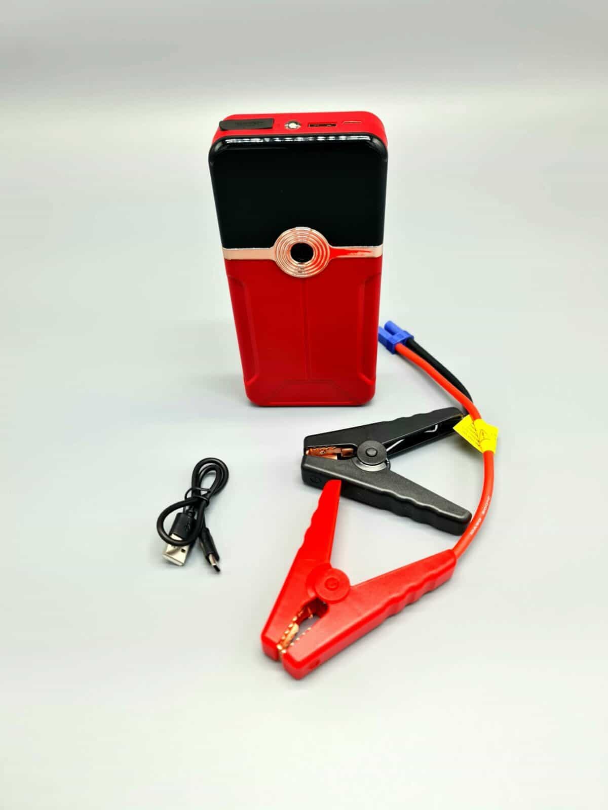 Auto jump starter with jumper cables and USB charging cable, portable emergency power supply for vehicles, batteries, and gadgets - Hot Deals LB optimized product image.