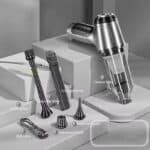 Vacuum cleaner accessories with long rod brush, small and coarse rod brushes, USB cable, and packing box for cleaning and maintenance.