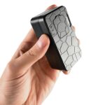 Rechargeable portable GPS tracker with honeycomb design, ideal for personal safety, tracking, and security applications. Perfect for travel, outdoor activities, and vehicle tracking.